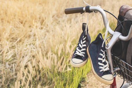 Jeans sneakers on bicycle ,Concept journey,hipster toneの写真素材