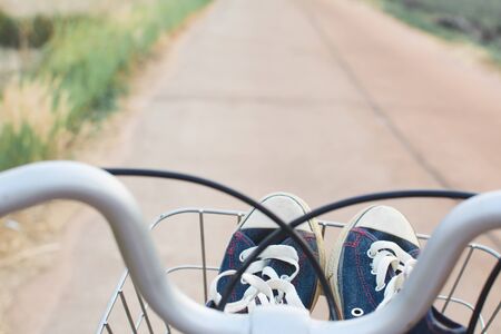 Jeans sneakers in basket ,hipster toneの写真素材