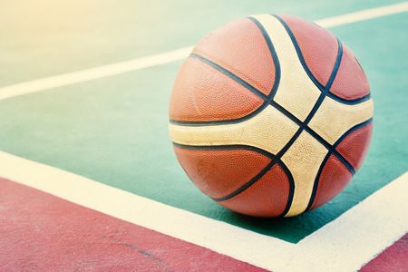 Close up basketball on ground in stadiumの写真素材
