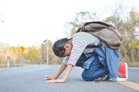 Happy Asian girl backpack  in nature background, Relax time on holiday concept travel ,color of vintage tone and soft focusの写真素材