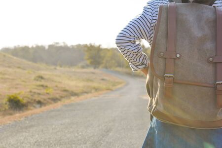 Happy Asian girl backpack  in nature background, Relax time on holiday concept travel ,color of...