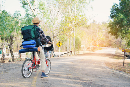 Hipster a man with bicycle in nature relax time on holiday. soft focus color of vintage toneの写真素材