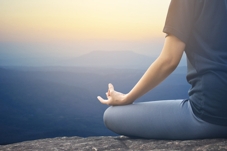Women yoga in nature background, color of vintage toneの写真素材