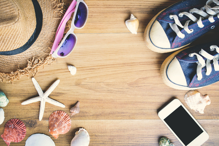 Accessory to travel on wood background, concept summer timeの写真素材