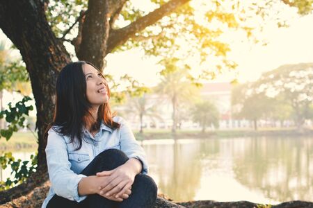 Beautiful women relaxing in the park, vintage tone and selective focusの写真素材