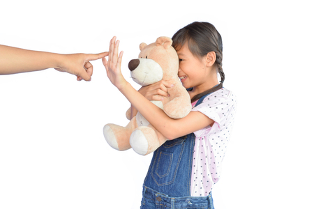 Portrait of little Asian girl scolded on white backgroundの写真素材