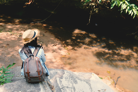 Hipster women travel in nature concept backpacker on holidayの写真素材