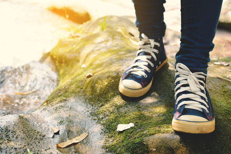 shoes on stone in nature concept walk in the forestの写真素材