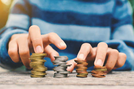 Hands girl holding coin selective and soft focus hipster toneの写真素材