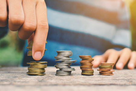 Hands girl holding coin selective and soft focus hipster toneの写真素材