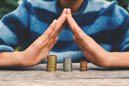 Hands girl holding coin selective and soft focus hipster toneの写真素材