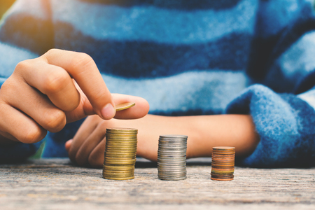 Hands girl holding coin selective and soft focus hipster toneの写真素材