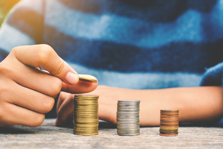 Hands girl holding coin selective and soft focus hipster toneの写真素材