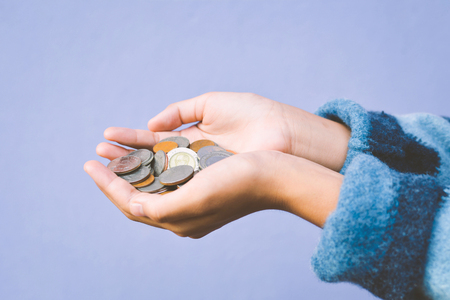 Hands girl holding coin selective and soft focus hipster toneの写真素材