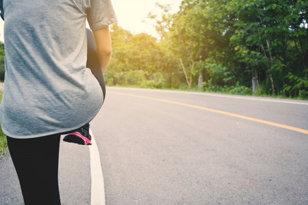Women running on the road for health, color of vintage tone selective and soft focus