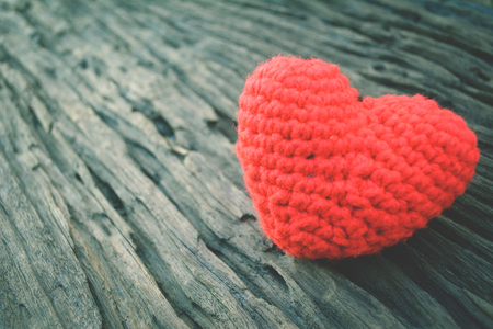Red heart on old wood color vintage toneの写真素材