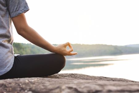Beautiful women yoga in nature, hipster tone and selective focusの写真素材