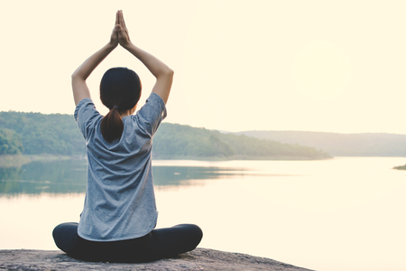 Beautiful women yoga in nature, hipster tone and selective focusの写真素材