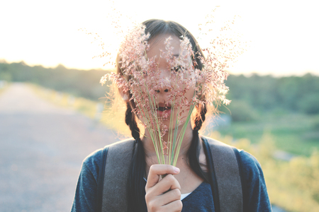 Happy Asian girl backpack on the road , Relax time on holiday concept travelの写真素材