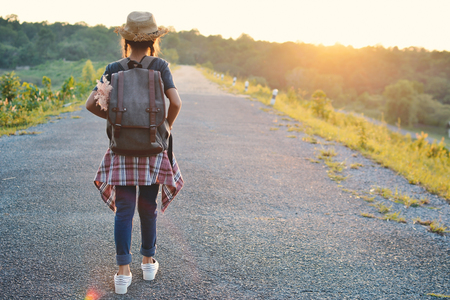 Happy Asian girl backpack on the road , Relax time on holiday concept travelの写真素材