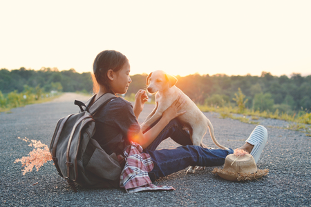 Happy Asian girl backpack on the road , Relax time on holiday concept travelの写真素材