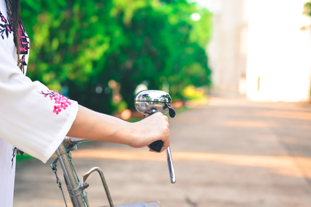 Beautiful women Vietnam with red bicycle in old city , selective and soft focus color vintage styleの写真素材