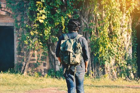 Hipster man backpacker in old city relax time on holiday concept travelの写真素材