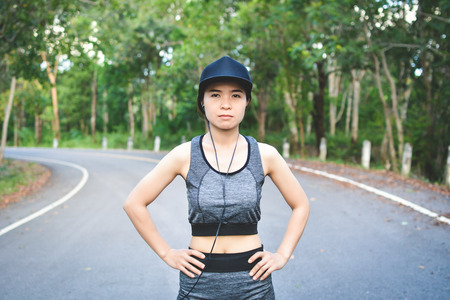 Women exercise and rest on road , color of hipster tone selective and soft focus