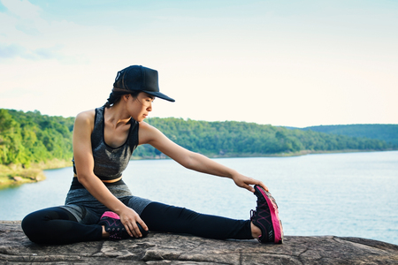 Women warm up before running on the road for health, color of hipster tone selective and soft focusの写真素材