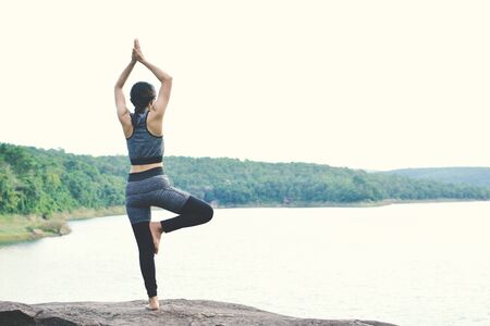 Beautiful women yoga in nature, hipster tone and selective focus
