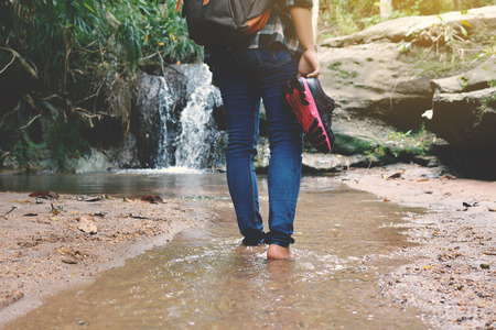 Shoes and feet women in nature concept walk in the forest