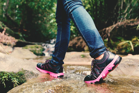 Shoes and feet women in nature concept walk in the forestの写真素材