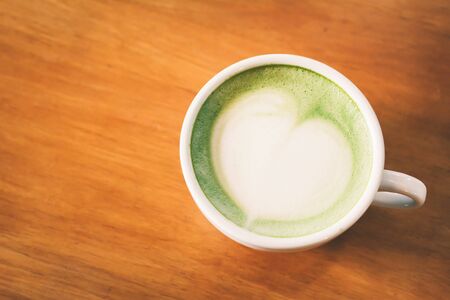 Green tea cup in cafe shop time to relaxing ,hipster tone and soft of focusの写真素材