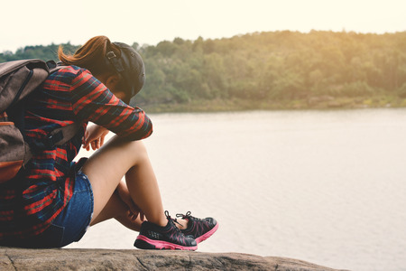 Asian women backpack in nature background, Relax time on holiday concept travel color of hipster styleの写真素材