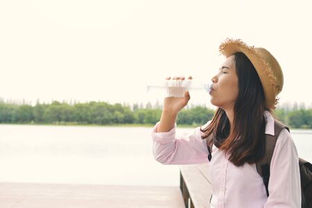 Women drinking water during travelの写真素材