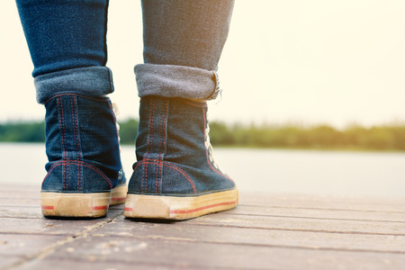 Feet of hipster women in park and nature background, Relax time on holidayの写真素材