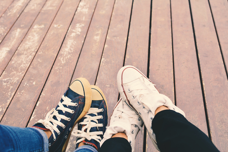 Feet of lover on old wooden background  color of hipster tone ,concept affectionの写真素材
