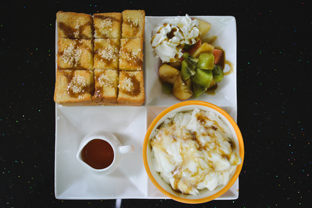 Honey toast on black table backgroundの写真素材