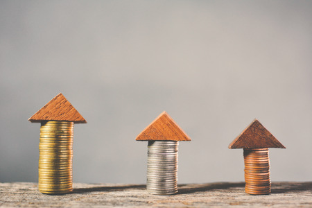 Coin on wood concept save money for real estateの写真素材
