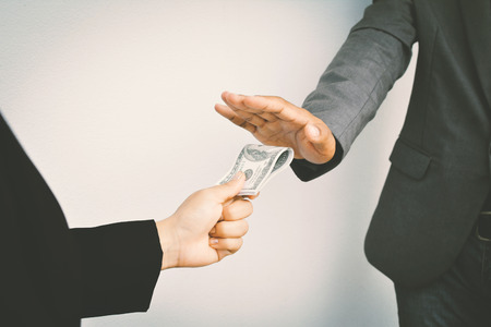 Close of businessman hands holding money color of vintage styleの写真素材