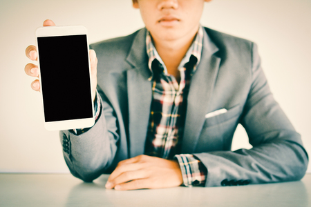 Businessman using smart phone color of vintage toneの写真素材