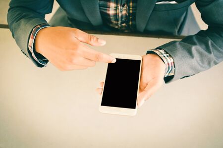Businessman using smart phone color of vintage toneの写真素材