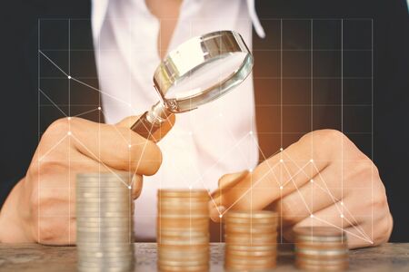 Business women saving for money with financial graphの写真素材