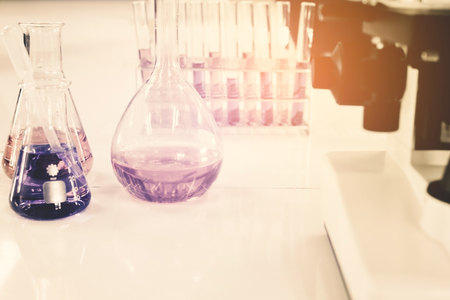 Test tube and microscope scientific experiment  in the laboratoryの写真素材