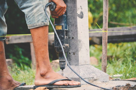 Close up man at work build a houseの写真素材