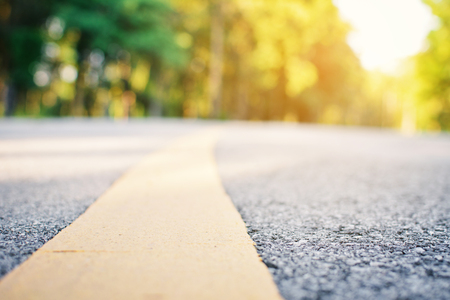 Close up on road and tree bokeh backgroundの写真素材