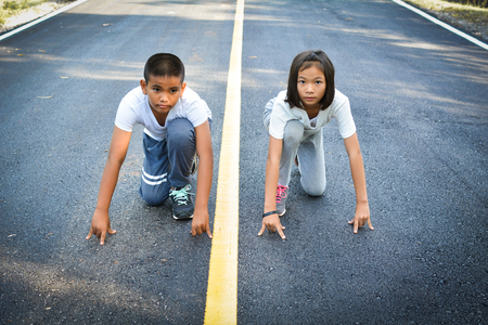 Children running on the road for health, soft focusの写真素材