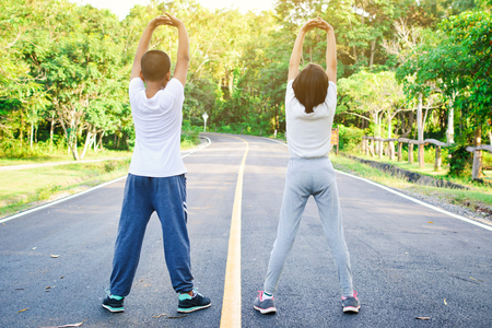 children warm up before running on the road, color of hipster tone selective and soft focusの写真素材