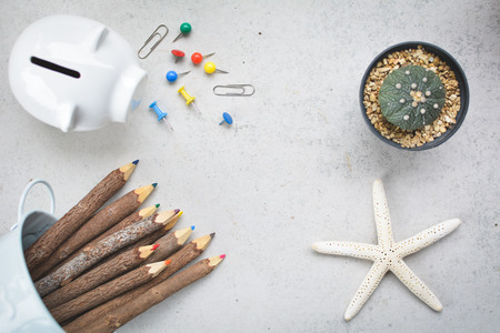 group of office equipment color pencil paper pins and clips on table