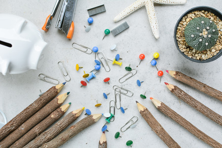 group of office equipment color pencil paper pins and clips on tableの写真素材